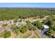 Aerial view of the home in a lush green community at 5198 Legend Hills Ln, Brooksville, FL 34609
