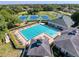Aerial view of the community pool and tennis courts at 5198 Legend Hills Ln, Brooksville, FL 34609