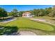 An aerial view of the home's large lot with a pool and golf course access at 5198 Legend Hills Ln, Brooksville, FL 34609