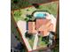 An aerial view of the home's large lot with a pool, tile roof and long driveway at 5198 Legend Hills Ln, Brooksville, FL 34609