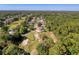 Wonderful aerial view of the home on a golf course with a pool, lush greenery and mature trees at 5198 Legend Hills Ln, Brooksville, FL 34609