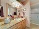 Charming bathroom with vanity, granite countertop, and a tiled shower at 5198 Legend Hills Ln, Brooksville, FL 34609