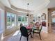 Inviting breakfast nook with large windows offering serene outdoor views and plenty of natural light at 5198 Legend Hills Ln, Brooksville, FL 34609