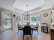 Bright breakfast nook with backyard access features a cozy spot for casual dining and relaxation at 5198 Legend Hills Ln, Brooksville, FL 34609