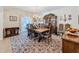 Elegant dining room is perfect for gatherings, boasting a china cabinet, a chandelier, and carpet at 5198 Legend Hills Ln, Brooksville, FL 34609