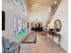 Grand foyer features tile floors, a stained glass window, and a sweeping staircase to the second floor at 5198 Legend Hills Ln, Brooksville, FL 34609