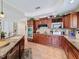 This large eat-in kitchen features granite counters, stainless appliances, and custom wood cabinetry at 5198 Legend Hills Ln, Brooksville, FL 34609