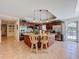 Gourmet kitchen with an island, stainless steel appliances, wine rack and dark wood cabinetry at 5198 Legend Hills Ln, Brooksville, FL 34609