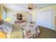 Inviting bedroom featuring a ceiling fan, carpeted floor and closet storage at 5198 Legend Hills Ln, Brooksville, FL 34609