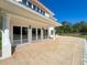 A beautiful patio featuring large sliding glass doors, providing seamless indoor-outdoor living and a view at 5198 Legend Hills Ln, Brooksville, FL 34609
