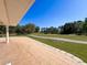 Expansive patio with a view of lush golf course; perfect for relaxing and enjoying the outdoors at 5198 Legend Hills Ln, Brooksville, FL 34609