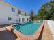 A beautifully designed swimming pool with brick trim, perfect for relaxation and outdoor enjoyment at 5198 Legend Hills Ln, Brooksville, FL 34609