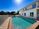 A beautiful swimming pool with lounge seating; perfect for outdoor entertainment and Gathering fun at 5198 Legend Hills Ln, Brooksville, FL 34609