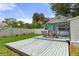 Charming backyard featuring a deck with outdoor seating and a well-maintained lawn, perfect for relaxing at 7252 Coventry Ct, Weeki Wachee, FL 34607