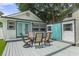 Backyard with outdoor table and seating, and building exterior at 7252 Coventry Ct, Weeki Wachee, FL 34607