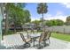 Backyard features a waterfront view, spacious patio, and table with seating at 7252 Coventry Ct, Weeki Wachee, FL 34607