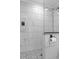 Bathroom boasts elegant marble tile, modern fixtures, and patterned tile floor in shower at 7252 Coventry Ct, Weeki Wachee, FL 34607