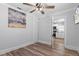 Bedroom with ceiling fan shows doorway view to adjoining kitchen space at 7252 Coventry Ct, Weeki Wachee, FL 34607