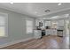 This kitchen boasts white cabinets, stainless appliances, and a window that offers natural light and outdoor views at 7252 Coventry Ct, Weeki Wachee, FL 34607