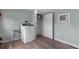 Laundry room with modern washer and dryer, utility closet and light green walls at 7252 Coventry Ct, Weeki Wachee, FL 34607