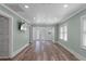 This is a shot of a living room. It has modern floors, and it leads to a screened-in porch at 7252 Coventry Ct, Weeki Wachee, FL 34607