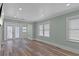 This is a living room. It has modern floors, and it leads to a screened-in porch at 7252 Coventry Ct, Weeki Wachee, FL 34607