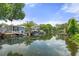 Waterfront view showcasing lush greenery, boat docks, and tranquil waterways, ideal for waterfront living at 7252 Coventry Ct, Weeki Wachee, FL 34607