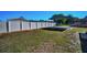 Spacious backyard with vinyl privacy fence and covered parking at 7321 Parrot Dr, Port Richey, FL 34668