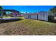 Spacious backyard with shed and covered parking area at 7321 Parrot Dr, Port Richey, FL 34668
