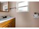 Bathroom features a modern sink and vanity with a large mirror, and updated fixtures at 7321 Parrot Dr, Port Richey, FL 34668