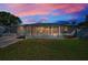 Charming single-story home with a well-maintained lawn and a screened front porch, perfect for enjoying the outdoors at 7321 Parrot Dr, Port Richey, FL 34668