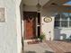 Close up of the front door, showing its welcoming design and charming exterior details at 7508 Cypress Knee Dr, Hudson, FL 34667
