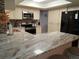 Bright kitchen with stainless steel appliances, modern countertops, and ample cabinet space at 7508 Cypress Knee Dr, Hudson, FL 34667