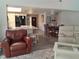 Open-concept living area showcases a seamless flow from the kitchen to the dining and living spaces at 7508 Cypress Knee Dr, Hudson, FL 34667