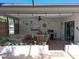 Inviting patio with grill, outdoor seating, unique decor, and potted plants creating a perfect space for relaxation and entertainment at 7508 Cypress Knee Dr, Hudson, FL 34667