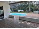Spacious screened in pool area with expansive tile flooring for leisure and entertainment at 7508 Cypress Knee Dr, Hudson, FL 34667