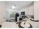 The kitchen features white cabinets and modern appliances at 7837 Hardwick Dr # 314, New Port Richey, FL 34653