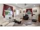 Comfortable sitting room with a wood floor, recliner chairs, and bright lighting at 8493 Belmont Rd, Spring Hill, FL 34606