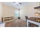 Bedroom with white wooden shelving, a desk and chair, and neutral colored carpet at 8604 Corinthian Way, New Port Richey, FL 34654