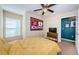 Bedroom with natural light, featuring sports memorabilia and television at 8604 Corinthian Way, New Port Richey, FL 34654