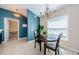Cozy dining area with a chandelier and view to bedroom at 8604 Corinthian Way, New Port Richey, FL 34654