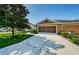 Charming home featuring a two-car garage, complemented by a driveway and front yard at 8604 Corinthian Way, New Port Richey, FL 34654