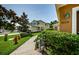 Lawn with manicured landscaping enhances the curb appeal of this inviting home at 8604 Corinthian Way, New Port Richey, FL 34654