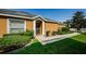 Inviting front entrance with well-maintained landscaping and a cozy front door at 8604 Corinthian Way, New Port Richey, FL 34654