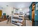 Bright kitchen with white cabinets, stainless appliances, and a breakfast bar at 8604 Corinthian Way, New Port Richey, FL 34654