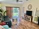Relaxing living room with sliding glass doors, wood floors and stylish decor at 8604 Corinthian Way, New Port Richey, FL 34654