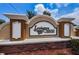 Close-up of the Lexington Commons community sign with brick base and manicured landscaping at 8604 Corinthian Way, New Port Richey, FL 34654