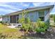 Serene backyard featuring mature landscaping, a cozy patio area, and a well-maintained lawn at 8635 Creedmoor Ln, New Port Richey, FL 34654