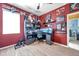 Red bedroom features a built-in desk area, perfect for a Star Wars fan or anyone needing a workspace at 8635 Creedmoor Ln, New Port Richey, FL 34654