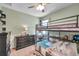 Cozy bedroom with bunk beds, playful decor, and plenty of space for activities at 8635 Creedmoor Ln, New Port Richey, FL 34654